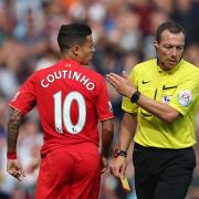 UNWANTED CARD: Philippe Coutinho has words with referee Kevin Friend after being shown a red card during the Premier League match between Liverpool and West Ham United recently