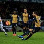 DOUBLE HIT: Arsenal's Santi Cazorla slips while taking a penalty at West Brom