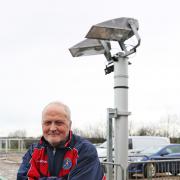 Ladybridge chairman Steve Hill with the club's new floodlights