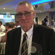 FIVE DECADES: Turton FC stalwart Ernie Charnock with his award from the West Lancashire League recognising 50 years of service to the football club