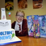 Molly Scot-Walker, 11 with her winning entry for the Bolton News Design a Cake competition.