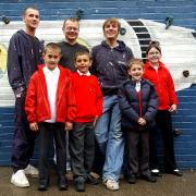 NEW DESIGNS: Back, from left, artists David Unsworth, Steve Farnworth and Ian Sharples with pupils, from left, Robert Clemson, George Baugh, William B