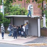 ANTI-SOCIAL: A Police Community Support Officer took this picture of yobs at a bus stop in New Lane, Breightmet