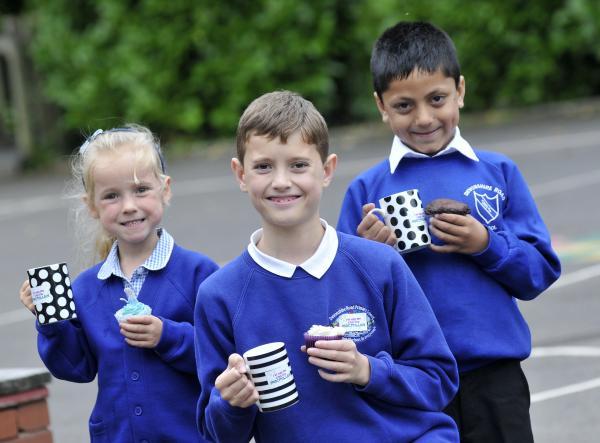 Devonshire Road Primary School pupils,
from left, Sophie Barnes, aged five, Thomas Seville, aged nine, and Alyaan Iqbal, aged five