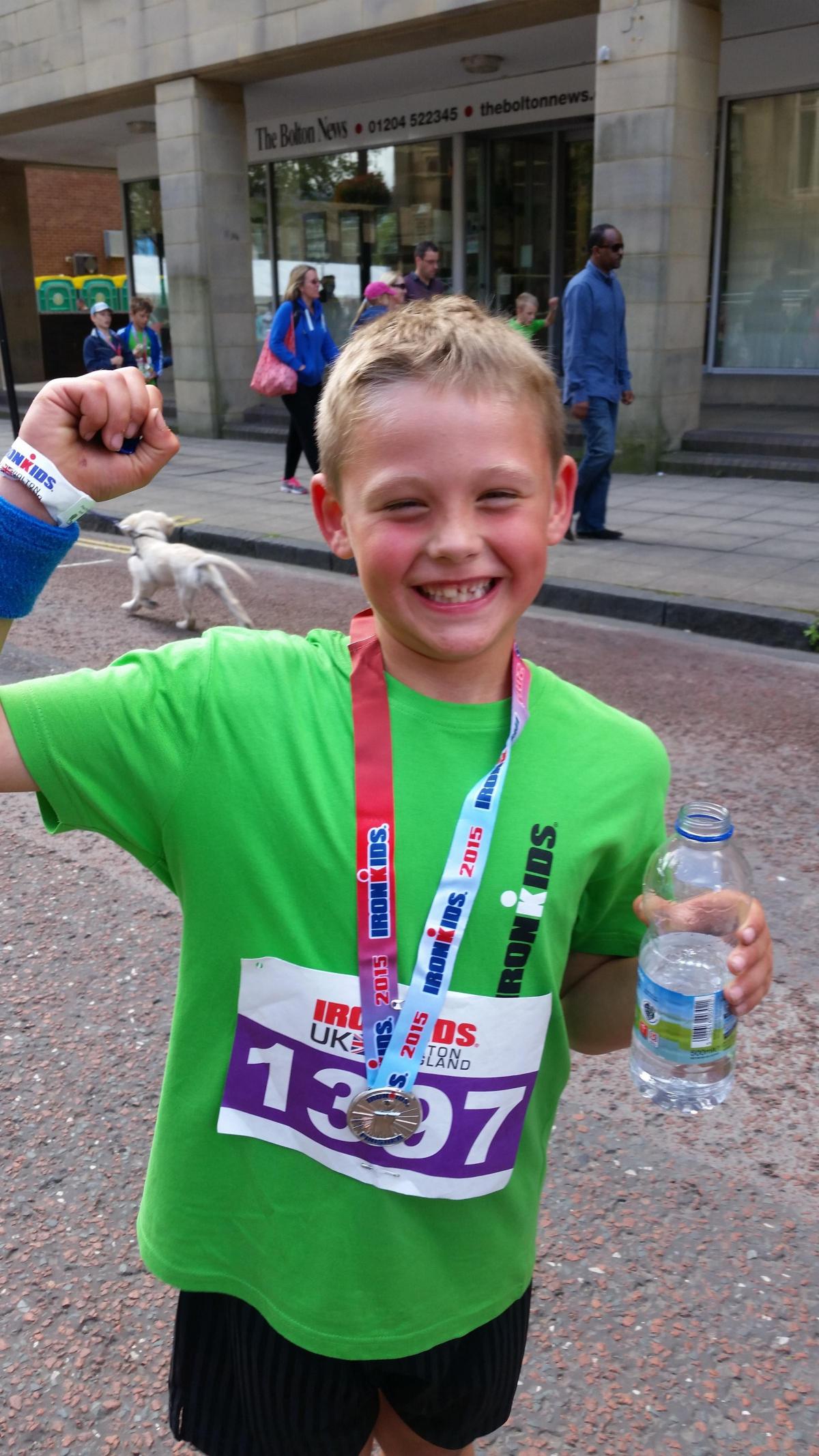 Seven-year-old Thomas Farnell, from Horwich, after competing in his first Ironkids race today.