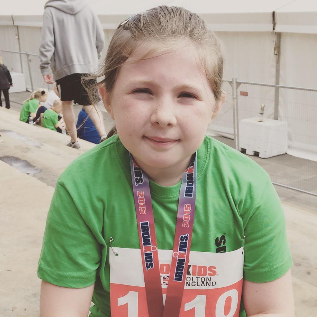 Keira Gilroy, a year three pupil at St Thomas of Canterbury RC Primary School in Heaton, after completing her race.