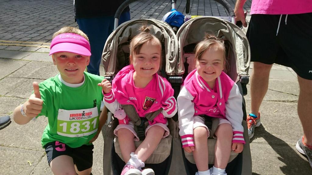 Six-year-old Finlay Parry with his team of supporters – twin sisters Abigail and Isobel, aged four.