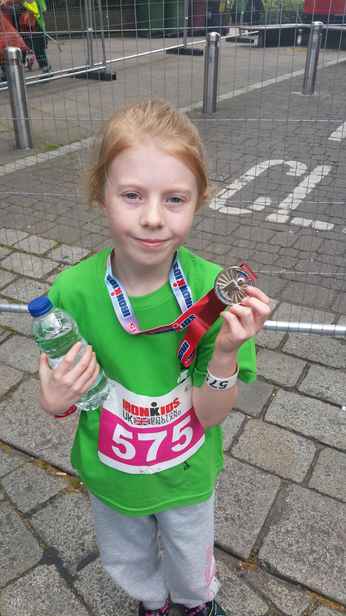 10-year-old Leah Hodge, from Westhoughton, shows off her medal.
