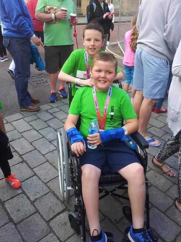 Daniel Holden, who pushed his best friend Jaykob Maggs, to the finish line. Both boys are aged nine.
