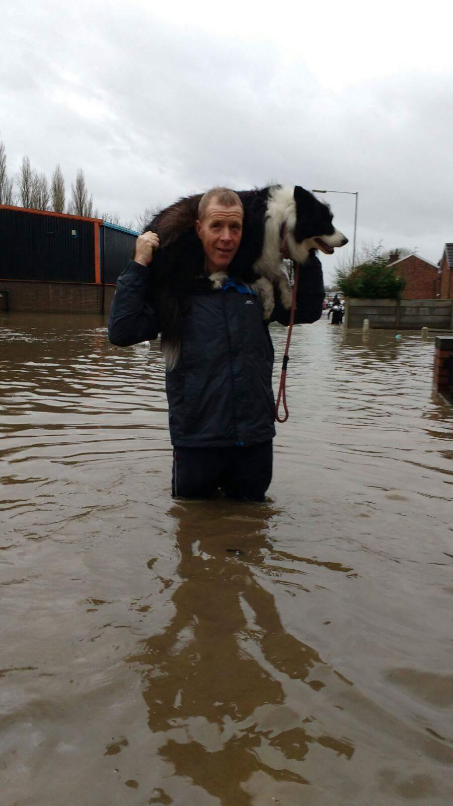 Michael O'Shaughnessy of Whewell Avenue, Dumers Lane fleeing from their home whilst saving Chica the family dog.
Picture credit: Janette O'Shaughnessy 
Sent in by Charlotte Moran from Bury