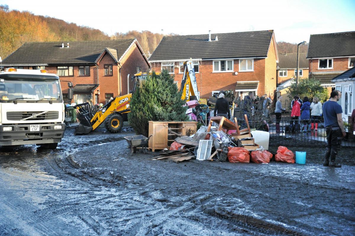 Work continues on the clean up in Riverside Drive, Stoneclough, after the devastating floods