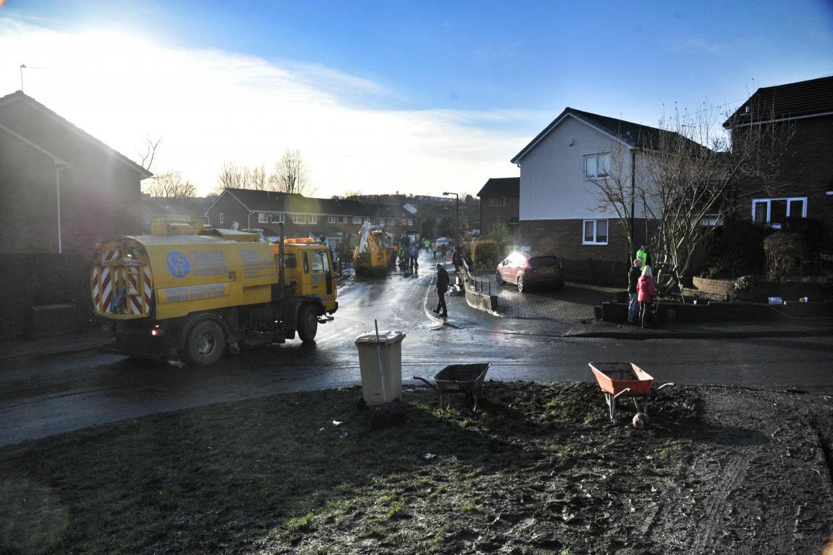 Work continues on the clean up in Riverside Drive, Stoneclough, after the devastating floods