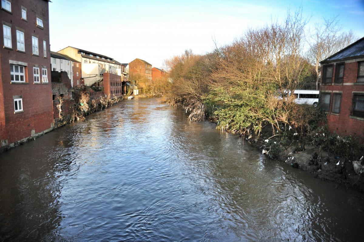 The river all quiet the day after flooding in Radcliffe