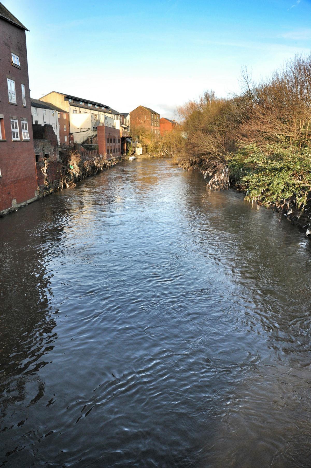 The river all quiet the day after flooding in Radcliffe