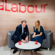 Dr Dan Poulter signing his Labour Party membership form with Ellie Reeves MP, Labour's deputy national campaign co-ordinator