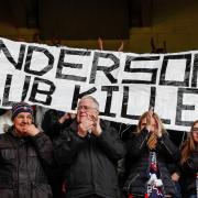 Bolton Wanderers fans show their displeasure to the former owner of the club