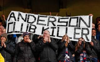 Bolton Wanderers fans show their displeasure to the former owner of the club