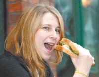 TUCKING IN: University of Bolton student Zoey Tattersall with a sandwich made from thick-sliced bread