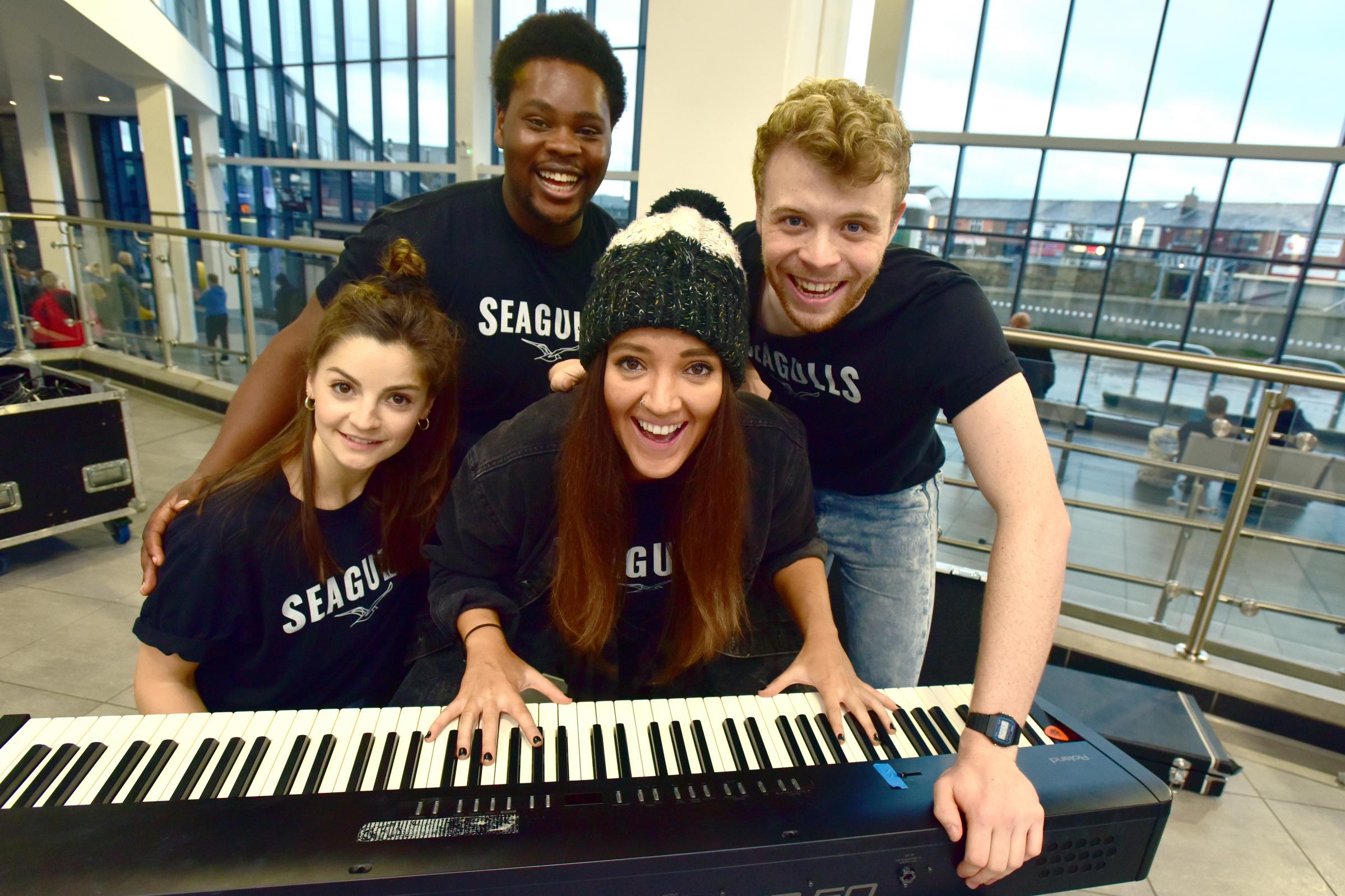 Actors from the Octagon Theatre put on a show at Bolton Interchange