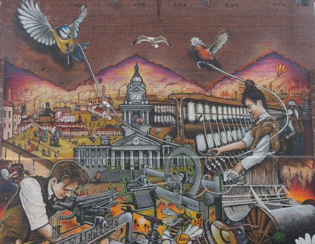 The Bolton News: The mural on Saville Street features details such as the town hall and Samuel Cromtpon's spinning mule