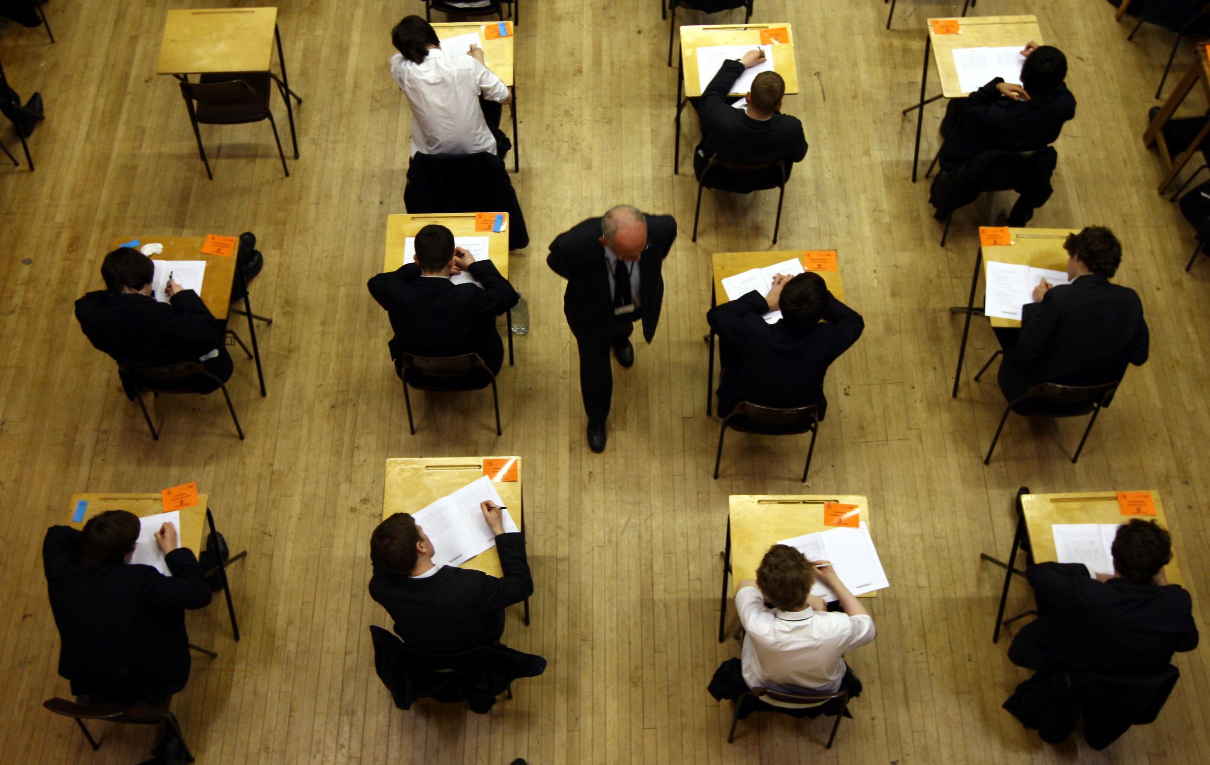 File photo dated 07/03/12 of a general view of pupils sitting an exam. A-level and GCSE students will receive grades determined by their teachers earlier in August to give them more time to appeal, the Education Secretary has announced. Issue date: Thursd