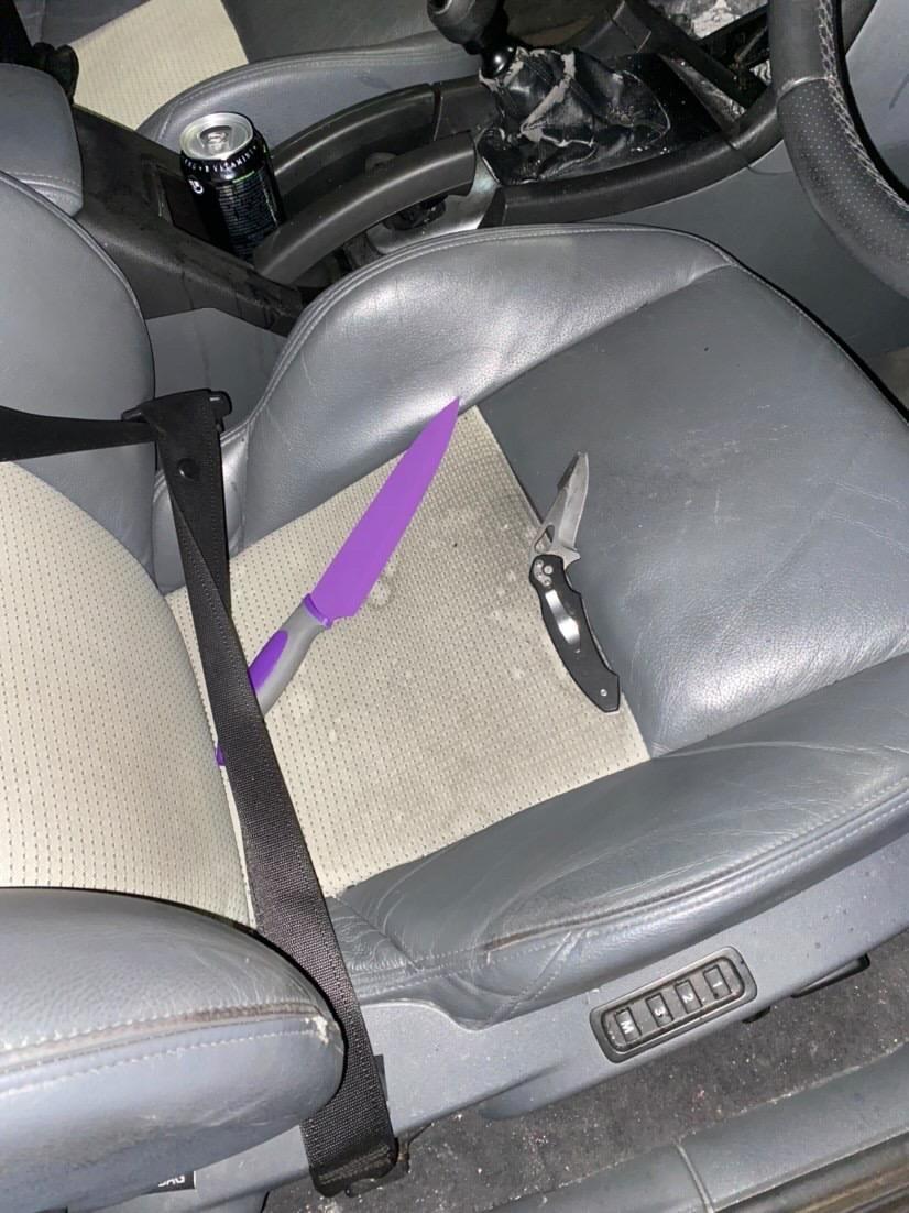 Two knives on the seat of a car