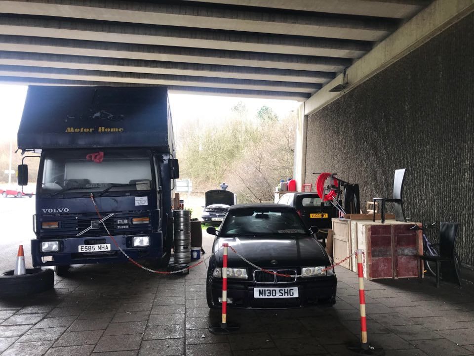 A mystery man has set up home under the motorway bridge at Darwen Services, leaving residents puzzled about why hes chosen that precise location 