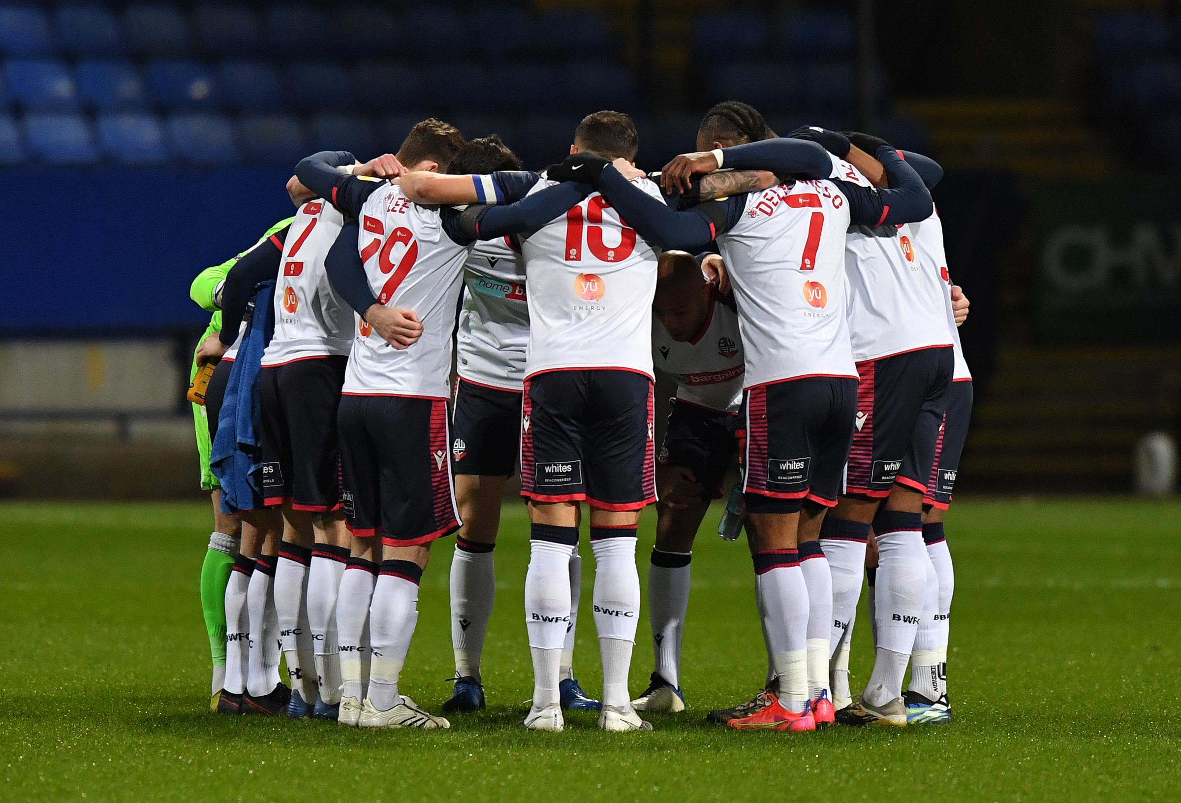 The Bolton Wanderers players in a huddle before the kick off Photographer Dave Howarth/CameraSport The EFL Sky Bet League Two - Bolton Wanderers v Cambridge United - Tuesday 9th March 2021 - University of Bolton Stadium - Horwich, Bolton World