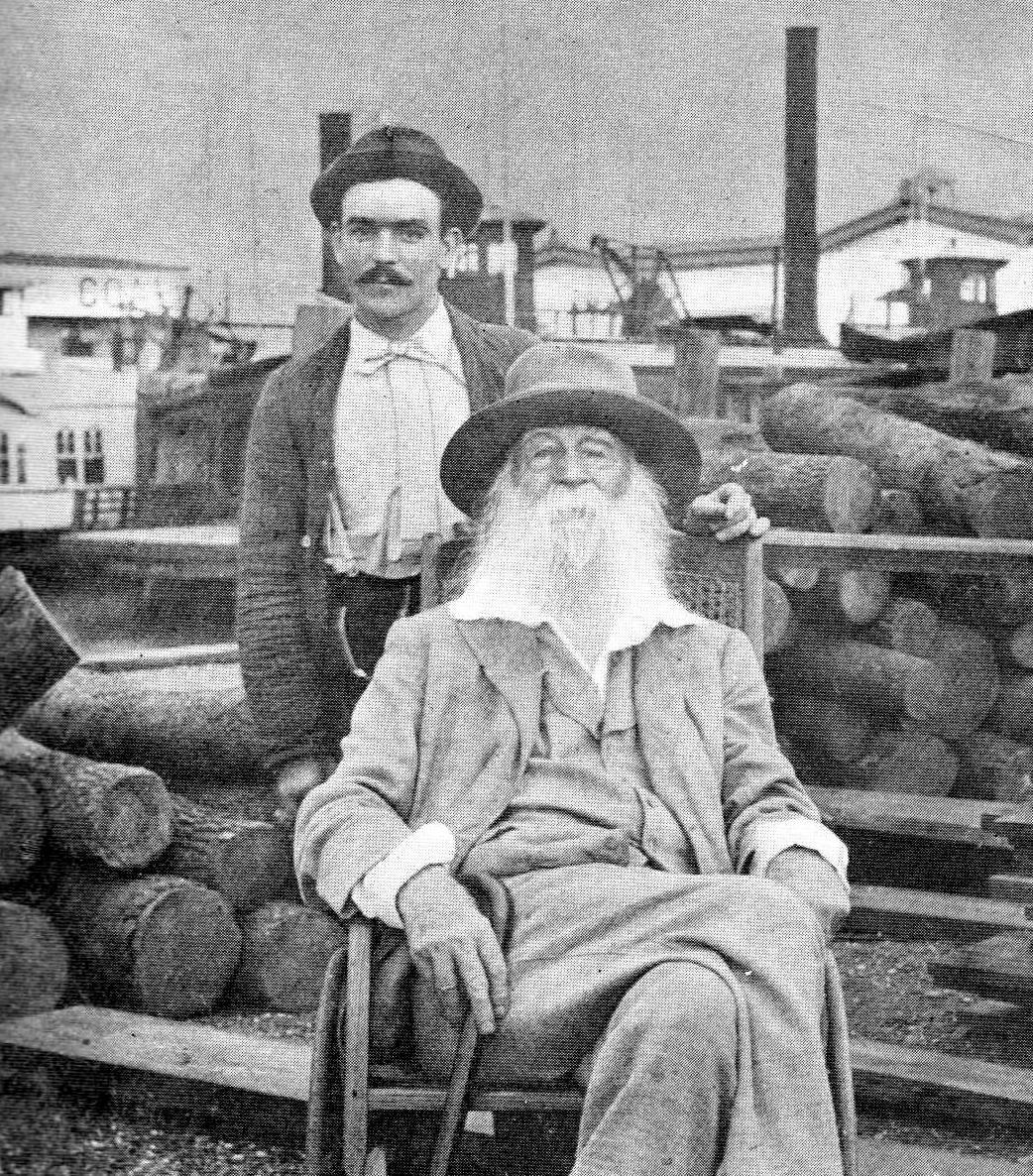 Walt Whitman with his carer Warry Fitzinger in a photo taken by John Johnston in Camden Wharf, New Jersey in 1890