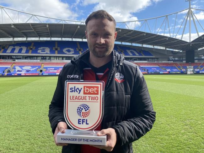 Ian Evatt with his manager of the month award for March
