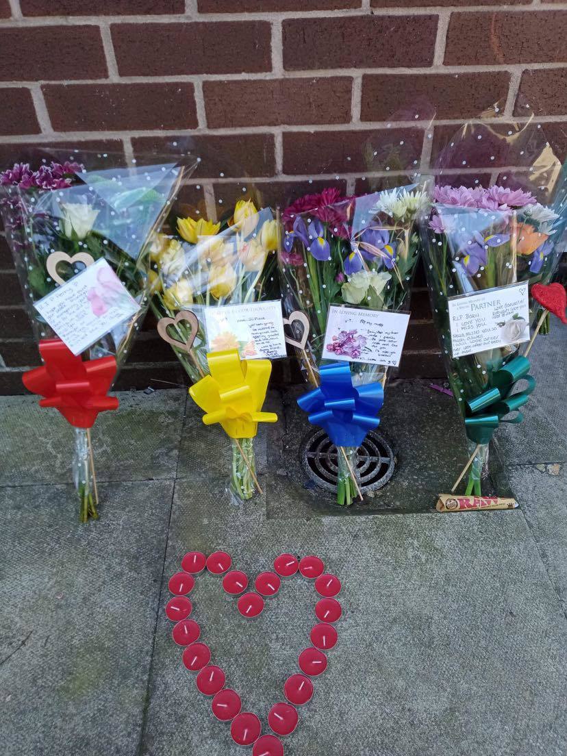 Tributes to Perry Greenhalgh outside of his flat