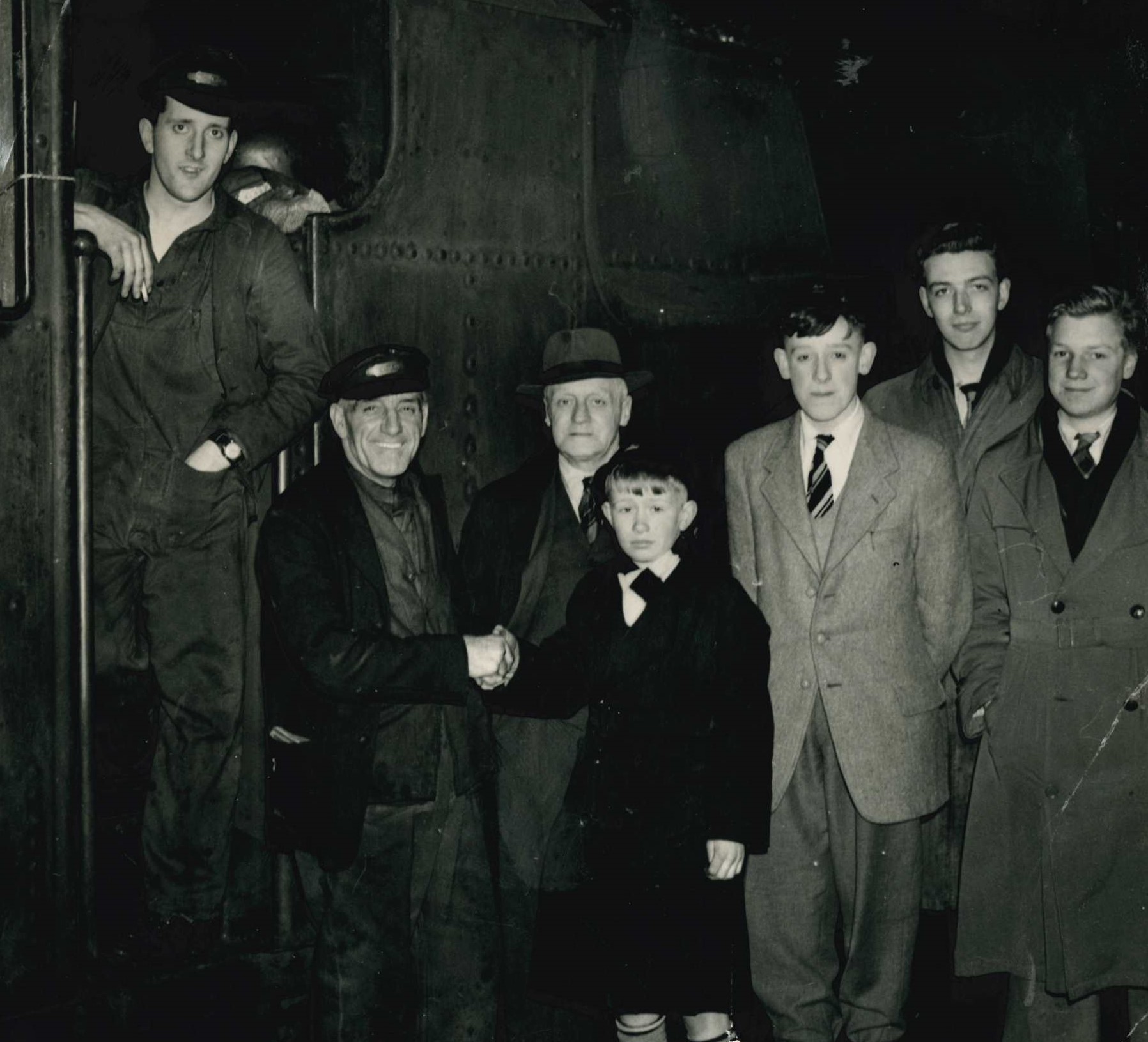 POIGNANT: The last passenger train leaves Great Moor Street Station, Bolton in March 1954. Christopher Mullineaux shakes hands with the driver Mr J Bethel