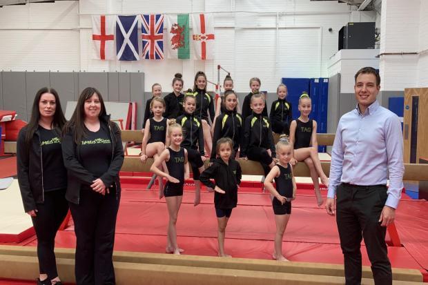 Left to right Owners of Tumbles Academy of Gymnastics Donna McLean and Gemma Scott together with members of their gymnastics squad and managing director of Moss Industrial Estate Neill Wood