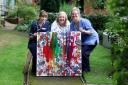 RAFFLE: Ann McFadden shows her Bubble Rush inspired artwork to nurses at Bolton Hospice