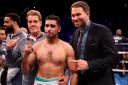 Amir Khan celebrates with trainer Joe Goossen (left) and promoter Eddie Hearn after beating Samuel Vargas on points after their Welterweight contest at Arena Birmingham, Birmingham