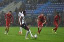 Amadou Bakayoko scores from the penalty spot for Wanderers against Liverpool.