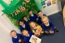 Students at Prestolee with Dexter the IQM teddybear