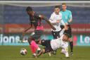Bolton Wanderers' Dion Charles in action with Exeter City's Cheick Diabate