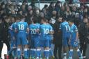 Ian Evatt gathers his players during the 2-1 defeat at Derby County