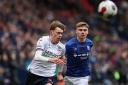 Bolton Wanderers' Conor Bradley chases a pass with Ipswich Town's Leif Davis close by