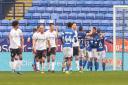 Wanderers players walk away dejected after going 2-0 down against Ipswich Town