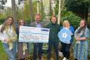 St Ann's Hospice staff presented with a cheque after the Christmas tree collection