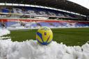 Snow piles up around the pitch before Bolton's FA Cup game with Everton in 2013