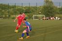 Daisy Hill’s Ben Howarth (in red) on the ball during the 3-0 win against Tottington United