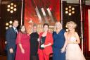 Anna Perrott, Panache Cruises’ head of supplier relations (centre), together with colleagues from Panache Cruises and Jules Verne, accepts the award from Mark Wright, TV personality and Lucy Huxley, Editor-in-chief, Travel Weekly