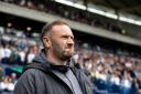 Ian Evatt looks on at Wanderers' 4-0 defeat to Wigan Athletic