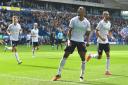 Victor Adeboyejo celebrates his goal against Peterborough United