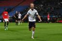 Luke Matheson celebrates Bolton Wanderers' eighth goal against Manchester United