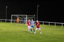 Daisy Hill’s Sam Twist, centre, being shadowed by Bacup’s Mason Fallon and Alex Mellor on Monday night