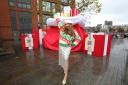 TV personality Charlotte Dawson with the sack of presents in Piccadilly Gardens
